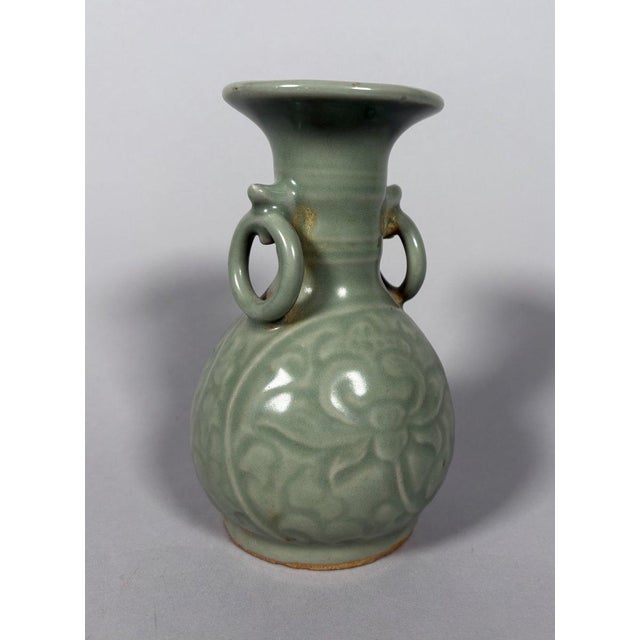 Longquan celadon stoneware vase, Yuan-Ming Dynasty. Incised celadon vase with a lotus flower motif. Globular in shape,...