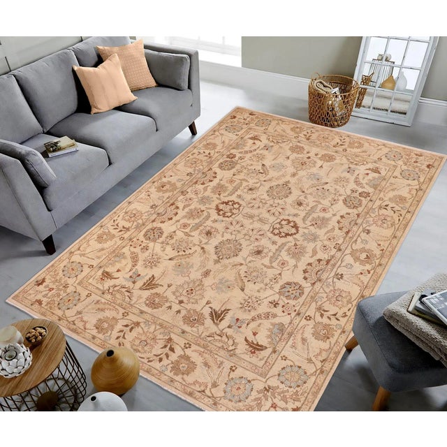 "Enhance the ambiance of your home with this magnificent Persian-influenced Turkish hand-knotted rug made by skilled...