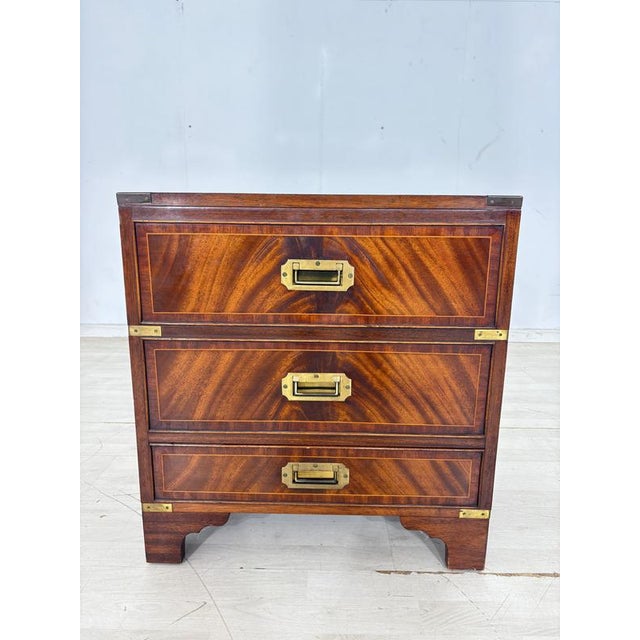 Beautiful English colonial-style, exceptional campaign chest of drawers. Crafted from fine mahogany with a stunning,...