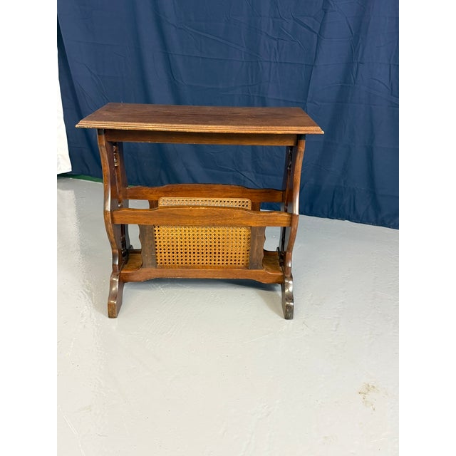 Vintage wooden magazine rack side table. This dual-purpose piece serves as an occasional or bedside table while providing...