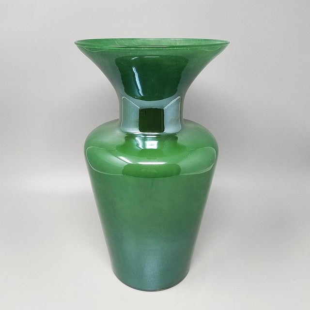 1970s Luxury green handcrafted vase in Murano glass by Maestro del Vetro. Made in Italy. The item is in excellent...