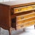 A cherrywood chest of drawers in the Louis XV style, crafted in the second half of the 20th century and modeled after...