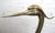 Decorative statue of water bird crane or egret. Black painted wood body with brass legs and head. Please confirm location...