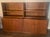 A versatile modern storage system which consists of 4 sections made of walnut. The bases each have two doors with magnetic...