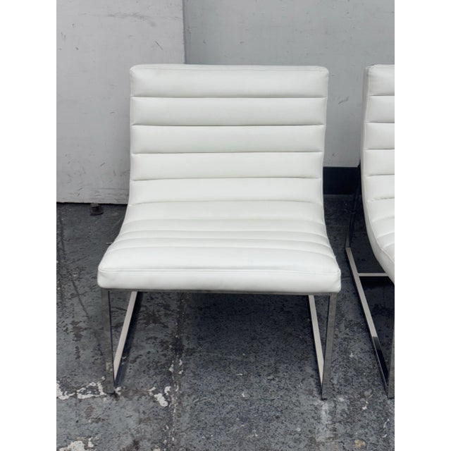 Design Plus Gallery presents a Pair of Taher Chairs from Noble House. Features a contoured and ribbed seat, upholstered in...