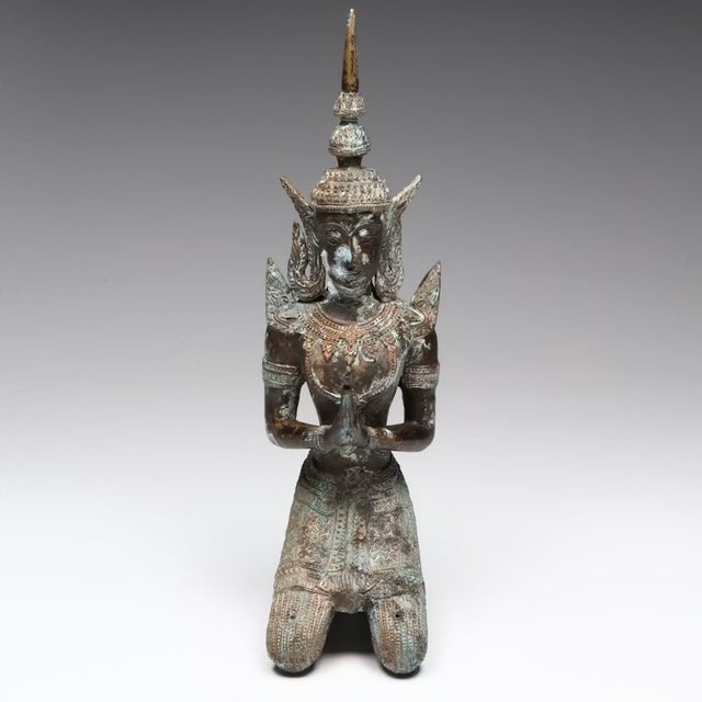 This lovely Thai bronze Thepphanom sculpture embodies the spiritual elegance and refined artistry of traditional Thai...