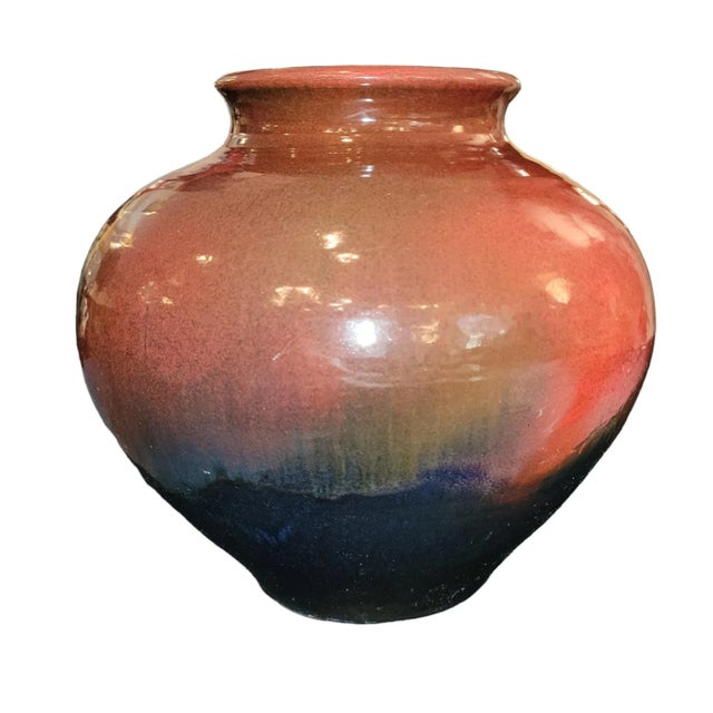 This magnificent pot is glazed in a red into black color. The under sider of the vase is signed as shown in the images....