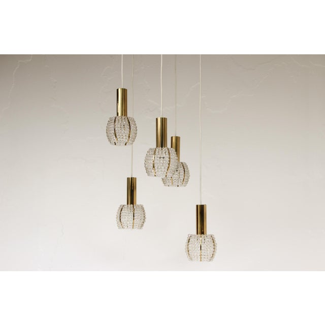 Vintage/Design Cascade ceiling light made of brass and acrylic, manufactured in Germany or Austria in the 1960s....
