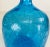 This is a large Blenko blue glass jar with its original stopper. This blue jar has a heavily crackled finish to the...