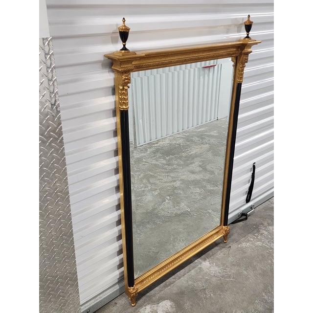 Carver's Guild 19th century Federal style mirror design with pillar. Featuring a giltwood frame, slender black painted...