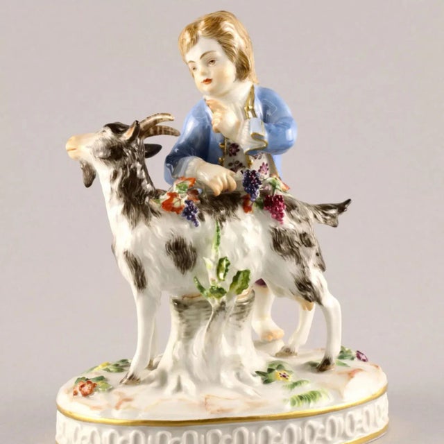 Porcelain figure "Boy with a goat". Allegory of autumn, harvesting. H-14.5 cm. The brand of the Meissen manufactory is a...