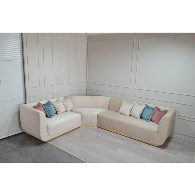 Cream L-Shaped Sectional Sofa with Gold Base and Velvet Cushions from Kabinet For Sale - Image 10 of 11
