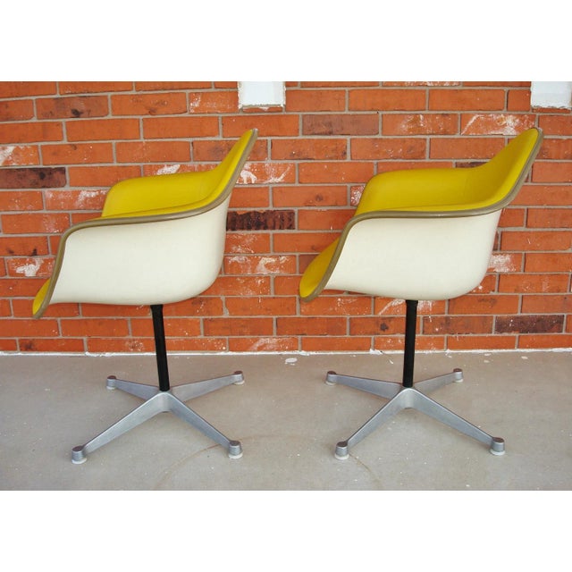 This is a striking pair of original 1960s vintage molded fiberglass shell chairs designed by Charles and Ray Eames for...