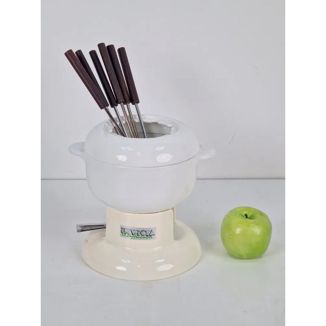 Vintage invicta diffusion fondue '70 with fondue set Cast iron fondue pan with white enamel inside and outside on the...