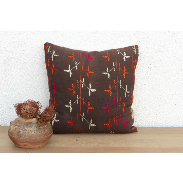 This 18-inch square pillow is a luminous masterpiece of Antique Phulkari craftsmanship, repurposed from a rare 19th-...
