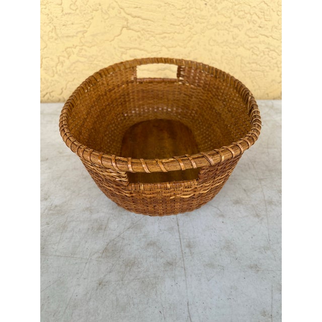 Vintage Oval Nantucket Lightship style basket, featuring a wooden base and finely woven rattan cane. Nantucket baskets...
