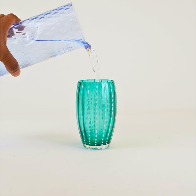 Collection for the table in clear colored glass. It includes tumblers for water and soft drinks, wine glasses, flute...