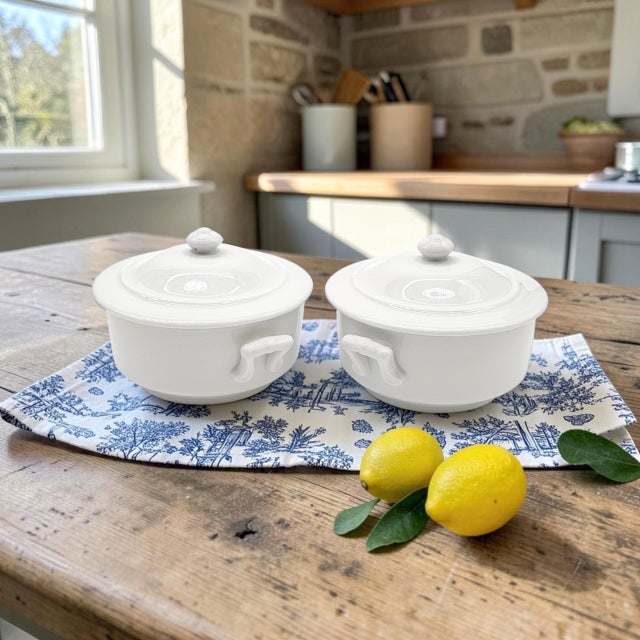 A matched pair of Apilco individual covered casserole dishes, produced in France during the late twentieth century. Each...