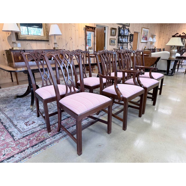 A refined set of Council dining chairs that embody the timeless character of Chippendale design. Each chair is crafted in...
