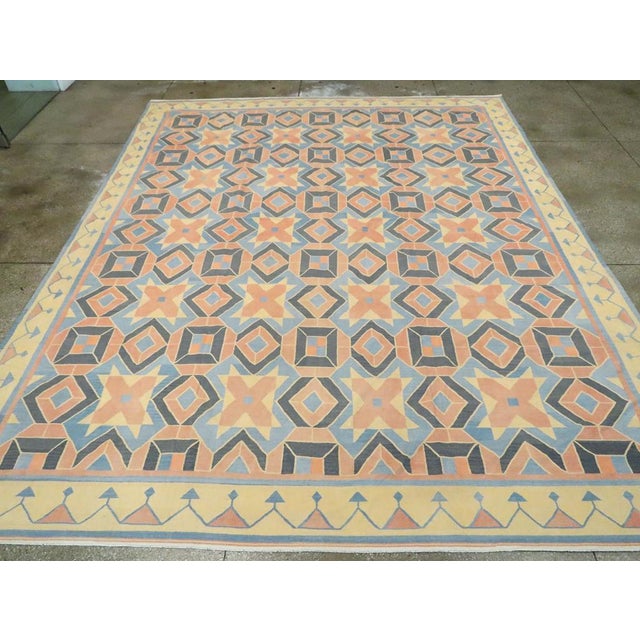 An Indian Flatweave Dhurrie large room size carpet handmade during the Mid-20th century. Measures: 12' 0" x 15' 1"