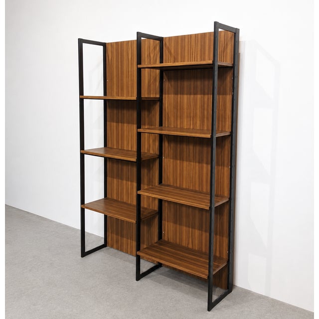 Modular wall unit by meurop, belgium, designed in the 1960s and 1970s. the piece features black lacquered metal uprights...