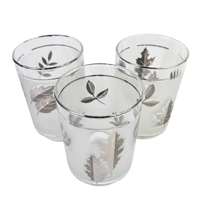 Add a stylish touch to your bar with this set of 3 frosted silver foliage tumblers by Libbey. In very good vintage...
