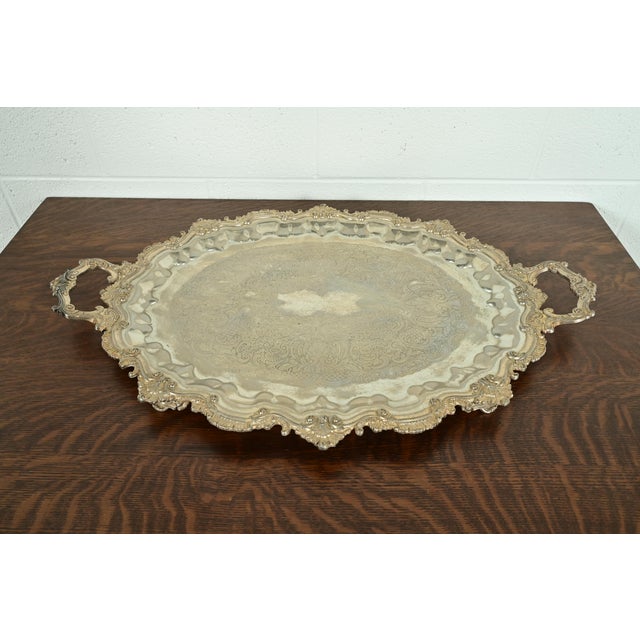 A gorgeous antique Victorian repoussé silver plate footed serving tray In the manner of Tiffany & Co. USA, Circa Late 19th...