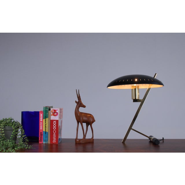This elegant and quite large 1950ies philips z- lamp displays the exemplary talent of the mid-century dutch product- and...