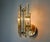 Very beautiful Venini wall lamp produced in Italy in the 70s. Triedi crystals supported by a gold metal structure. Unique...
