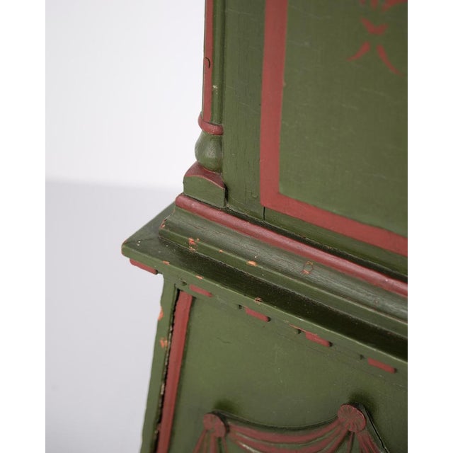Bornholm longcase clock “frøken” model from the 1860s, hand-painted with carved details in green/red paint. Antique...