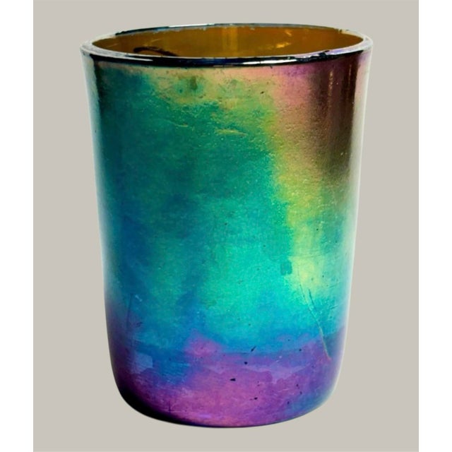 3.75” high 2.75” wide, made from rich cobalt blue glass, the exterior shimmers with luminous shades of teal, purple, gold,...