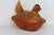 This lovely Lidded Candy Dish is made of glass. This piece presents an amber color throughout the piece with a depiction...