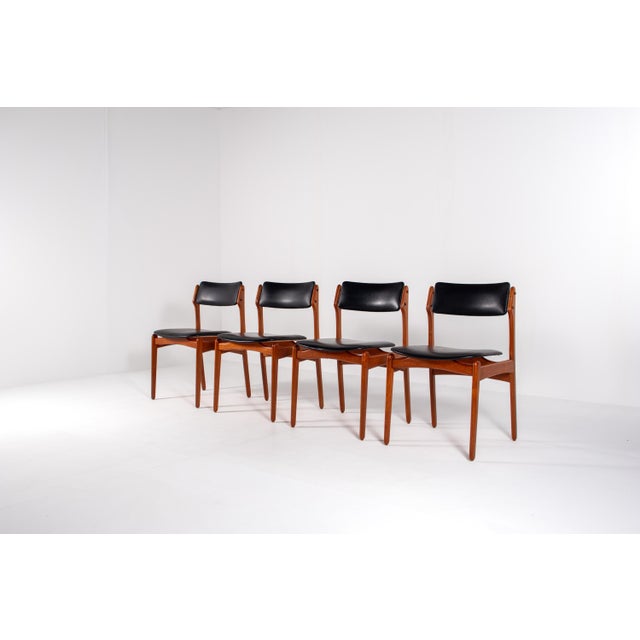 Set of four vintage Scandinavian dining chairs from the 1960s. Crafted in solid teak with elegant tapered legs and gently...