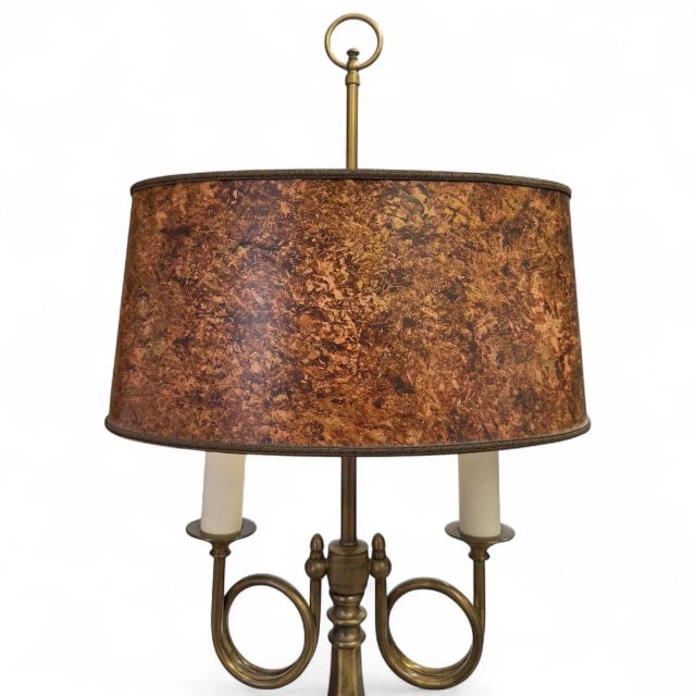 A classic Bouillotte style table lamp by Frederick Cooper consisting of a cast brass base having two arms with candle...