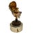 Flip open the globe to reveal a lighter. Twist the globe to wind the music box, which plays "Around The World in 80s Days"...