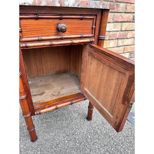 This is such a beautiful little French piece! Faux bamboo, with lovely tone and patina this cabinet would look adorable...