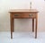 Elegant fruitwood side table with single drawer Lovely rich colour Antique brass handles. Possibly not original.