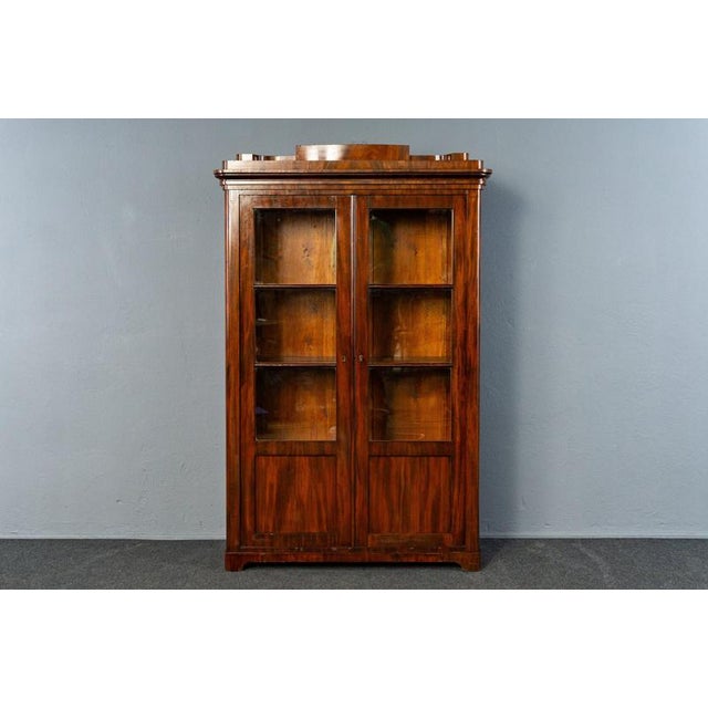 Object: Bookcase Era & Style: Biedermeier - first half of the 19th century Features - practical and elegant furniture with...