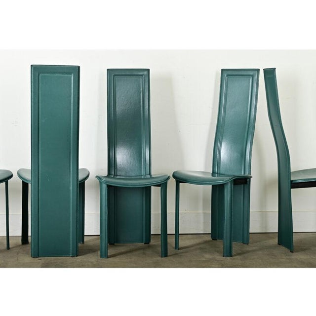 A very chic set of six Italian dining chairs, circa 1980, in the manner of designer Pietro Costantini. No visible marks on...