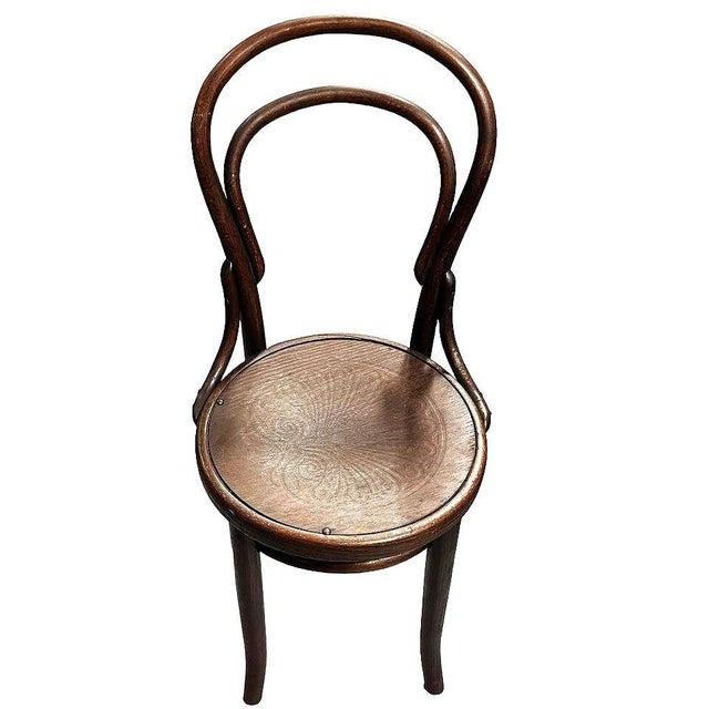 Vienna Secession Bent Oak Chair w/ Shell Seat No. 14 by Thonet features an elegant, sculptural frame crafted from warm-...