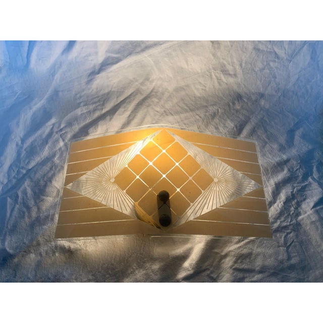 Pair of simple and elegant 1950s lamps. Printed and engraved glass. Brass structure, original 1950s with E14 lamp holder....