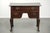 This antique English lowboy/side table dates from the 18th century and is made of oak. The side table has a luxurious look...