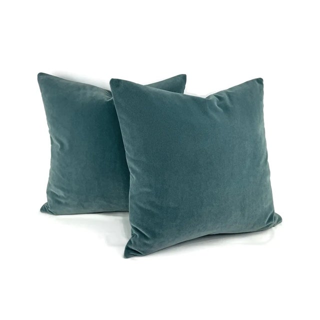 This stunning pillow features plush velvet in a beautiful smoky blue color. Luxurious and soft to the touch, bring this...