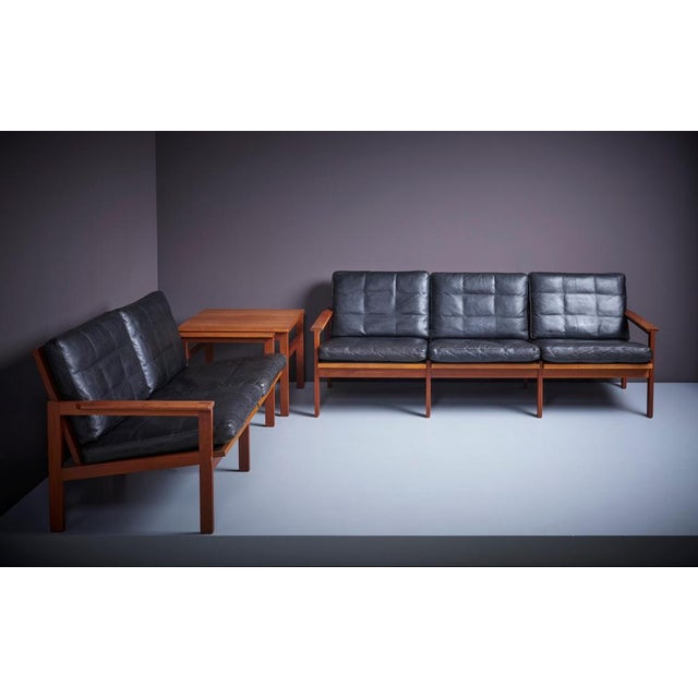 Original condition 'Capella' Set consisting of one 2 -seater sofa, one 3-seater sofa and a side table by Danish furniture...