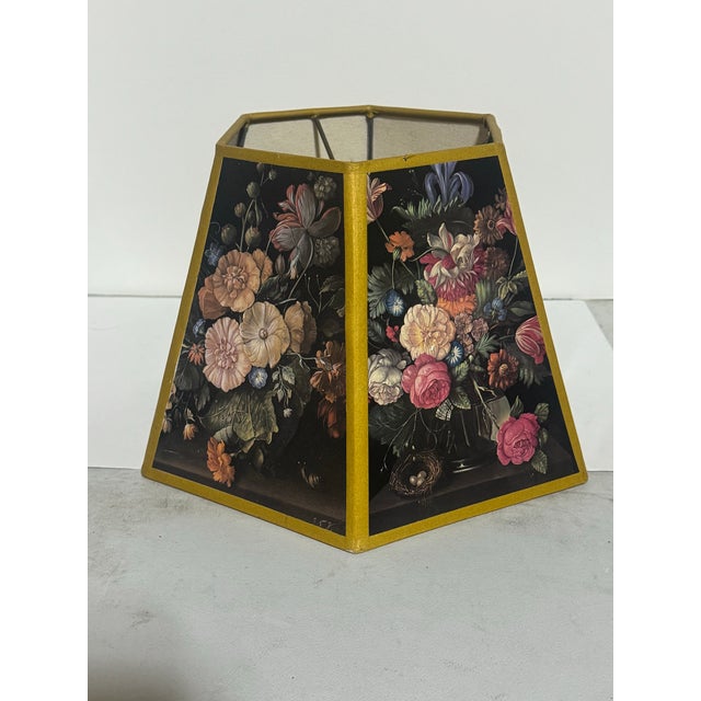 This is an UpgradeLights floral hex chimney style oil lampshade replacement. It features a black floral botanical pattern...