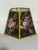 This is an UpgradeLights floral hex chimney style oil lampshade replacement. It features a black floral botanical pattern...