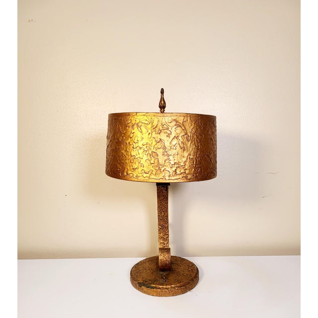 Now this piece is a stunner. A 1950s Spanish desk lamp that's been gold leafed makes this piece absolutely shine. It's...