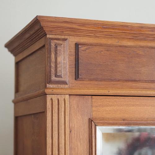 A single-door oak wardrobe and linen cabinet, made in france around 1900 in the louis xvi style. The cornice, body, and...
