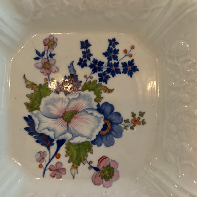Pair of decorative English floral-designed plates from 1850 purchased from famous designer Harold Slatkin of New York City.