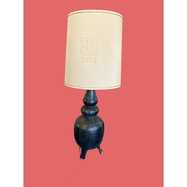 Rare Ebony Mid Century Lamp with Linen Barrel Shade, in the style of James Mont. Chalkware vessel shaped base has a matte...